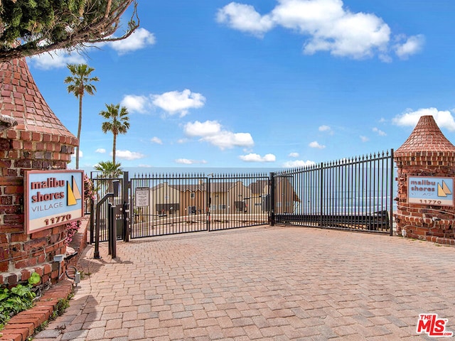 view of gate featuring a water view