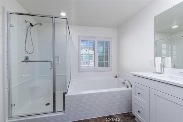 bathroom featuring vanity and plus walk in shower