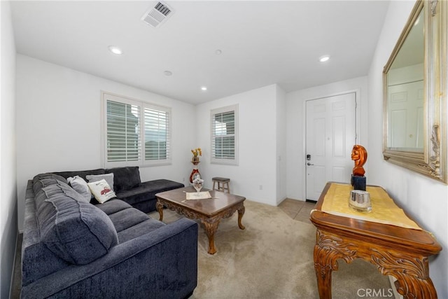 living room featuring light carpet