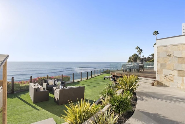 view of patio featuring outdoor lounge area and a water view