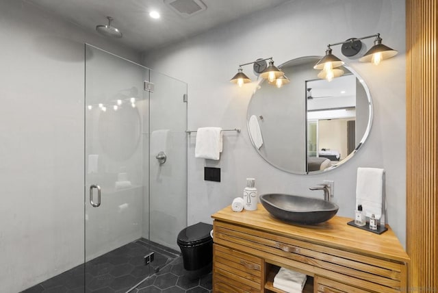 bathroom with vanity and a shower with shower door