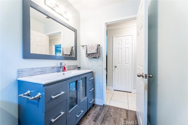 bathroom with hardwood / wood-style floors and vanity