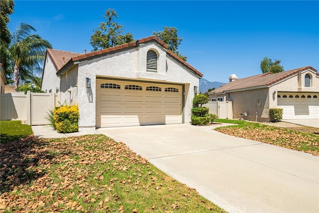 mediterranean / spanish house with a garage