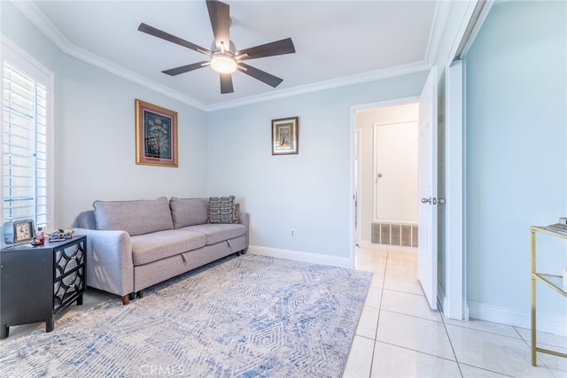 living room with ceiling fan, light tile patterned floors, and ornamental molding