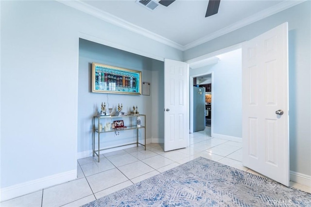 interior space featuring light tile patterned floors and crown molding