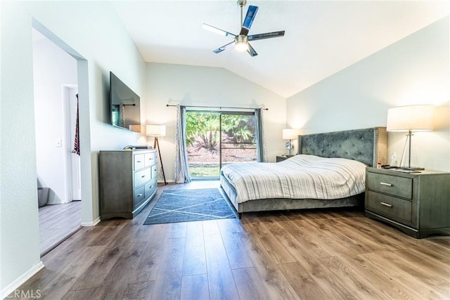 bedroom featuring light wood-type flooring, access to outside, vaulted ceiling, and ceiling fan