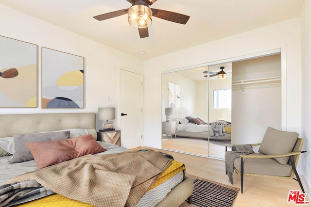 bedroom featuring ceiling fan and light hardwood / wood-style floors