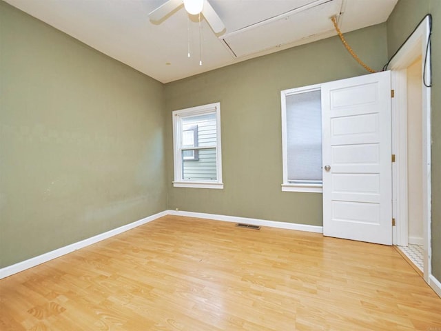 unfurnished room with ceiling fan and light hardwood / wood-style flooring