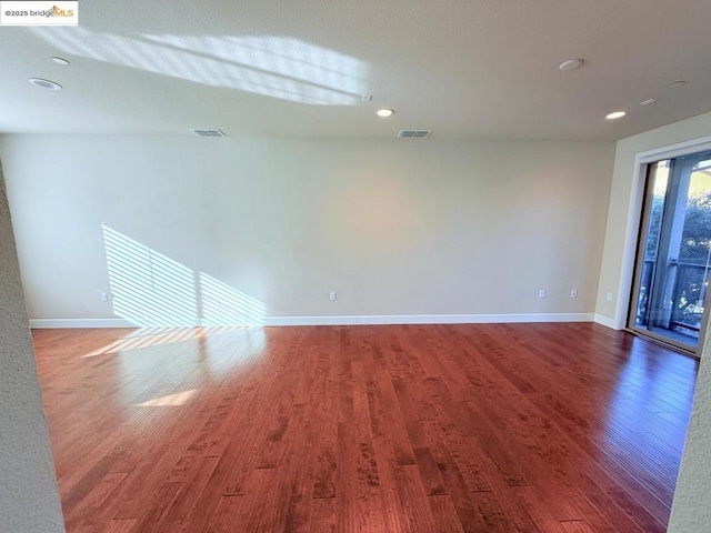 unfurnished room featuring hardwood / wood-style floors