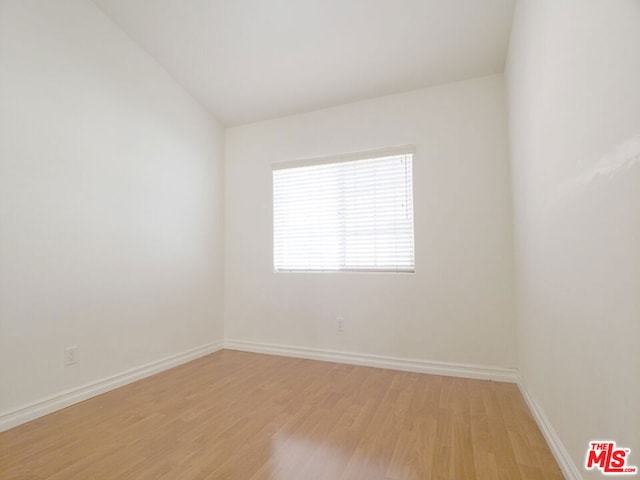 spare room with light wood-type flooring