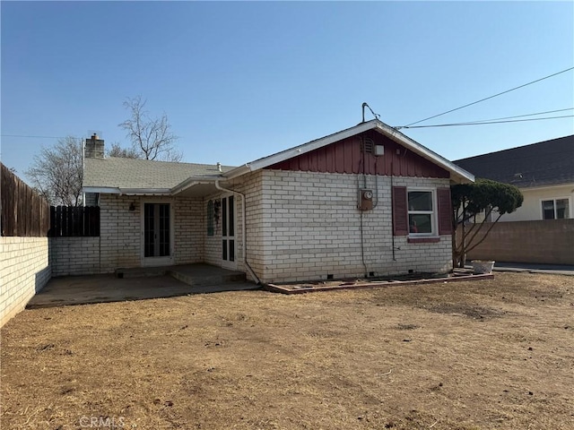 back of house with a patio