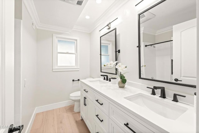 bathroom with toilet, a shower, crown molding, wood-type flooring, and vanity