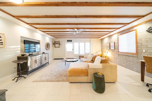 living room featuring beamed ceiling and brick wall