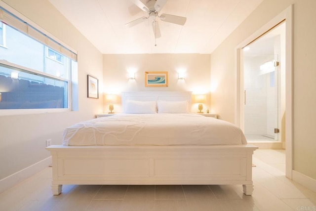 tiled bedroom with connected bathroom and ceiling fan