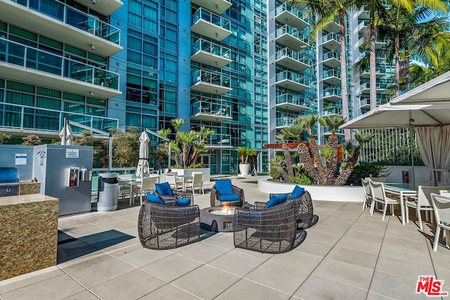 view of patio with an outdoor fire pit