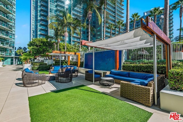 view of patio / terrace featuring a pergola and an outdoor hangout area