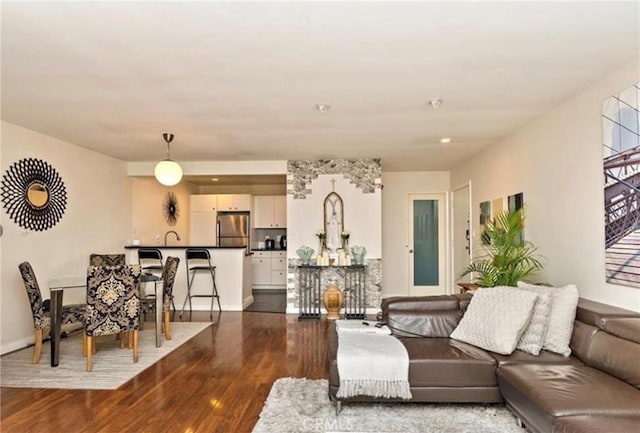 living room featuring dark wood-type flooring