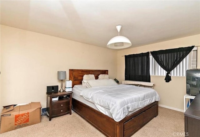 bedroom featuring light colored carpet