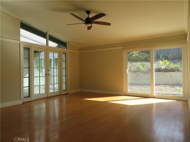 spare room with ceiling fan, french doors, wood-type flooring, and lofted ceiling