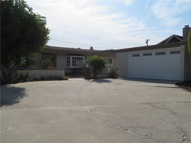 single story home with a garage