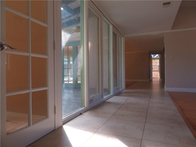 hallway with light tile patterned floors