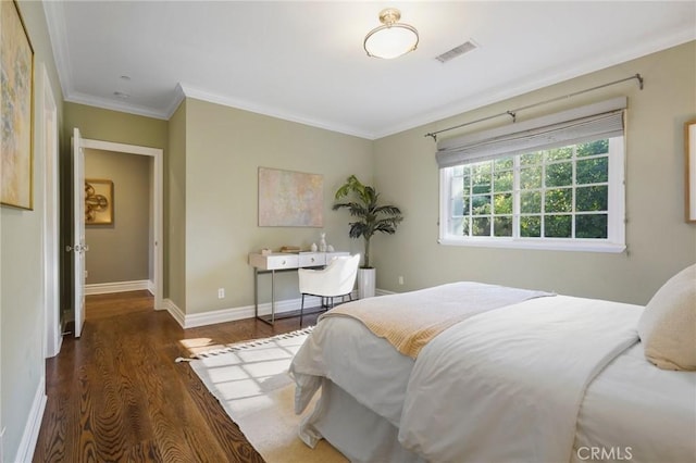 bedroom featuring crown molding, dark wood-style flooring, visible vents, and baseboards