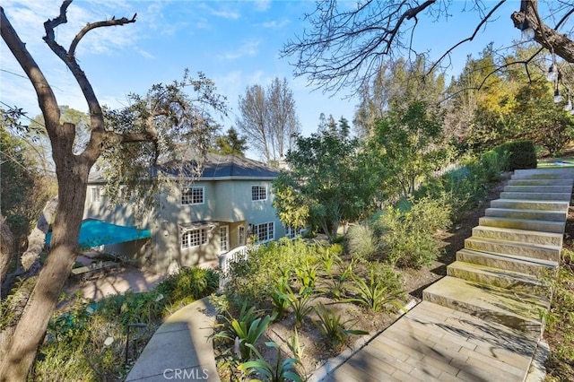 view of yard featuring stairway