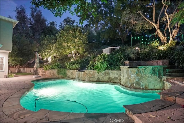 view of swimming pool with a patio area and a fenced in pool