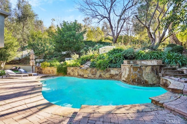 pool featuring a patio area