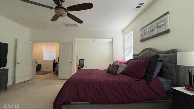 carpeted bedroom featuring ceiling fan