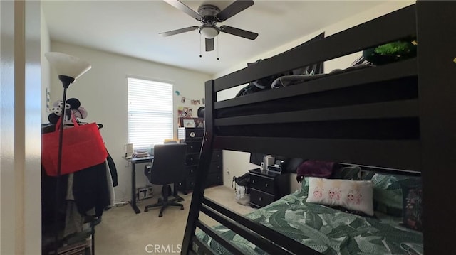 bedroom featuring ceiling fan and carpet