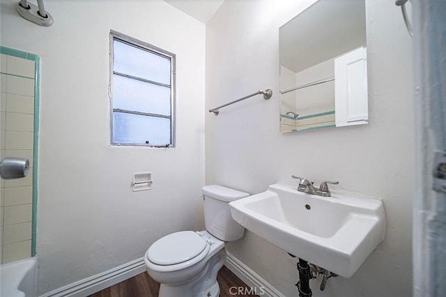 bathroom with sink, hardwood / wood-style floors, and toilet