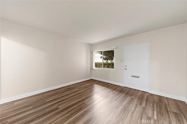 unfurnished room featuring hardwood / wood-style floors