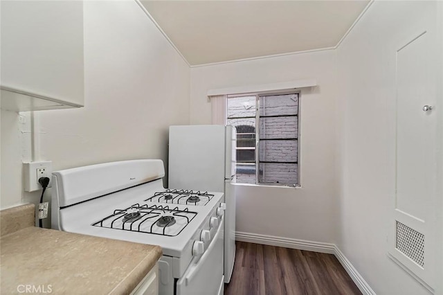 kitchen featuring white gas range, dark hardwood / wood-style floors, and ornamental molding