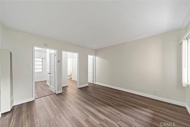 unfurnished bedroom with hardwood / wood-style floors