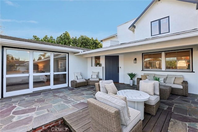 deck with an outdoor hangout area and a patio