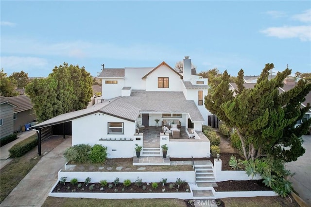 view of front of property featuring a carport