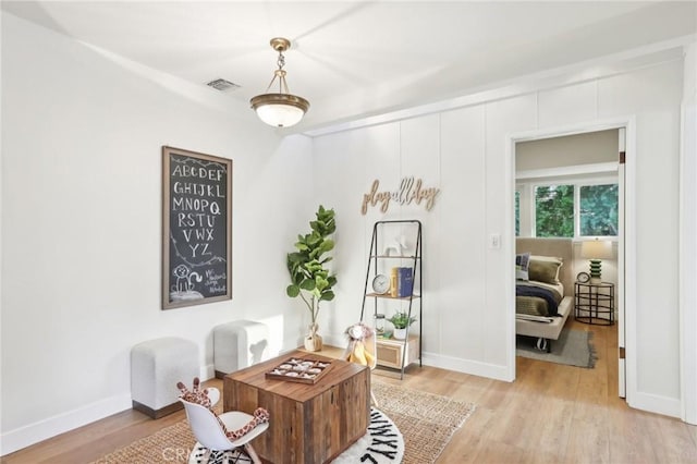 office space with light hardwood / wood-style floors