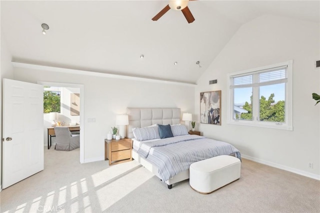 bedroom featuring ceiling fan, light colored carpet, and vaulted ceiling