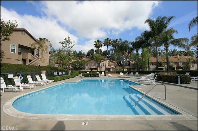 view of pool featuring a patio