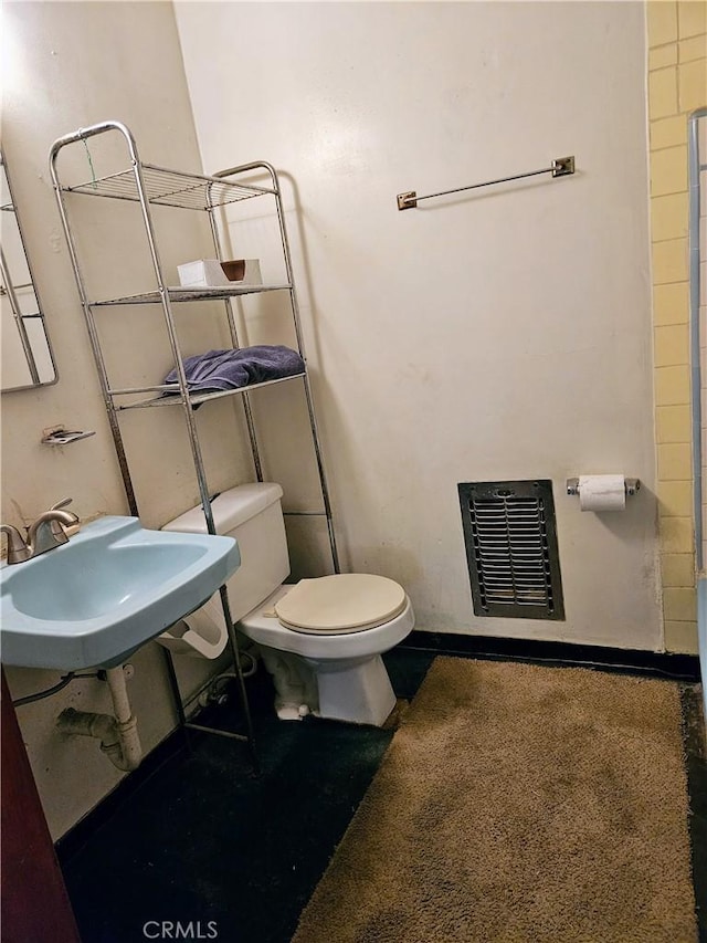 bathroom with sink and toilet