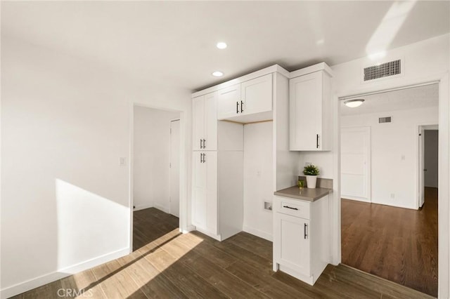 kitchen featuring white cabinetry