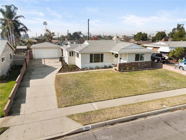 ranch-style home with a front yard and a garage