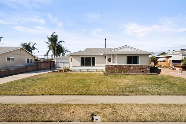 ranch-style home featuring a front yard