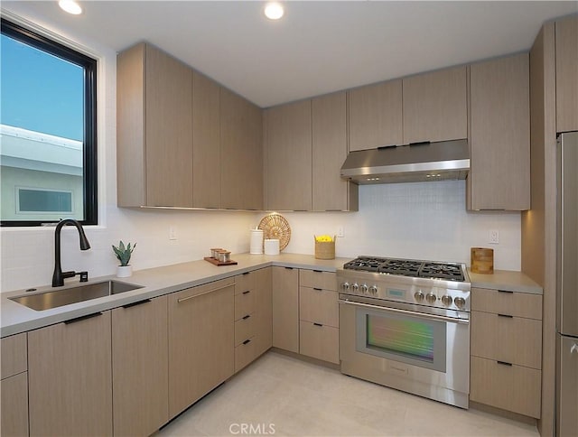 kitchen with sink, stainless steel stove, refrigerator, extractor fan, and light brown cabinets