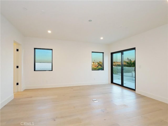 empty room with light hardwood / wood-style floors