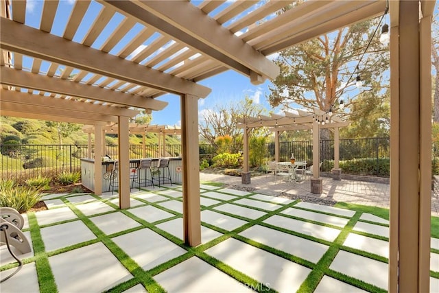 view of patio with a pergola and exterior bar