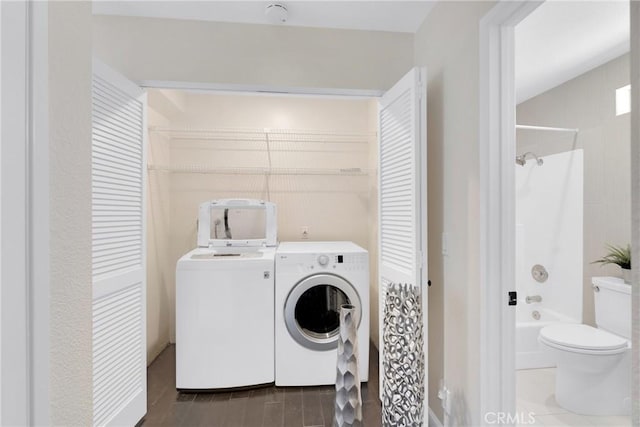 clothes washing area featuring washing machine and dryer