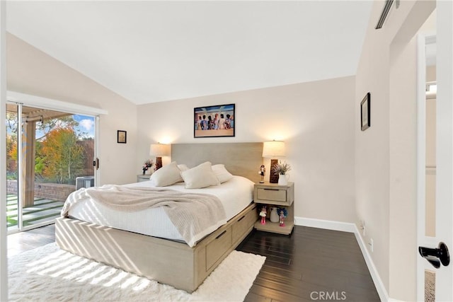 bedroom featuring dark hardwood / wood-style floors, access to outside, and vaulted ceiling