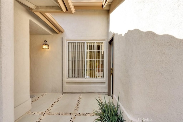 doorway to property with a patio